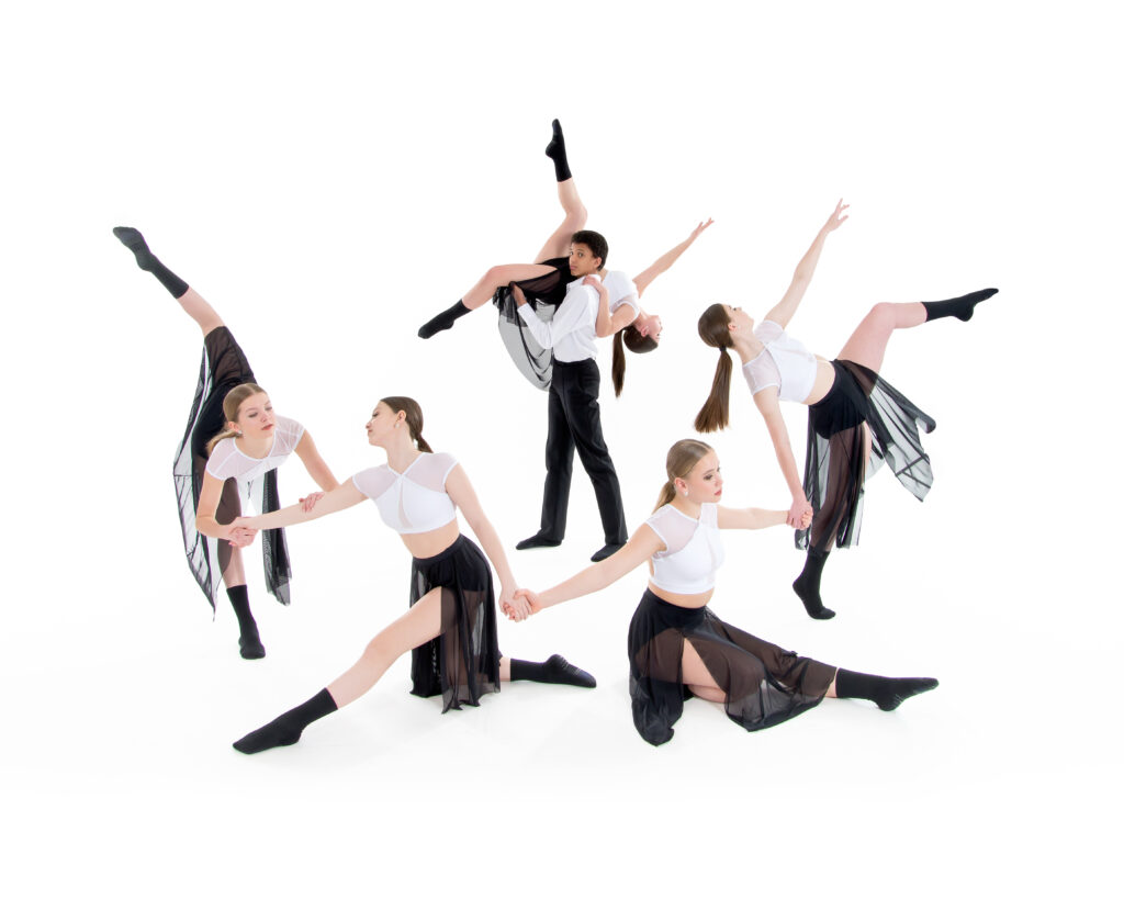 Dance group photo including a two person lift, arabesques, and attitudes. Students in white shirts and black skirts/pants.