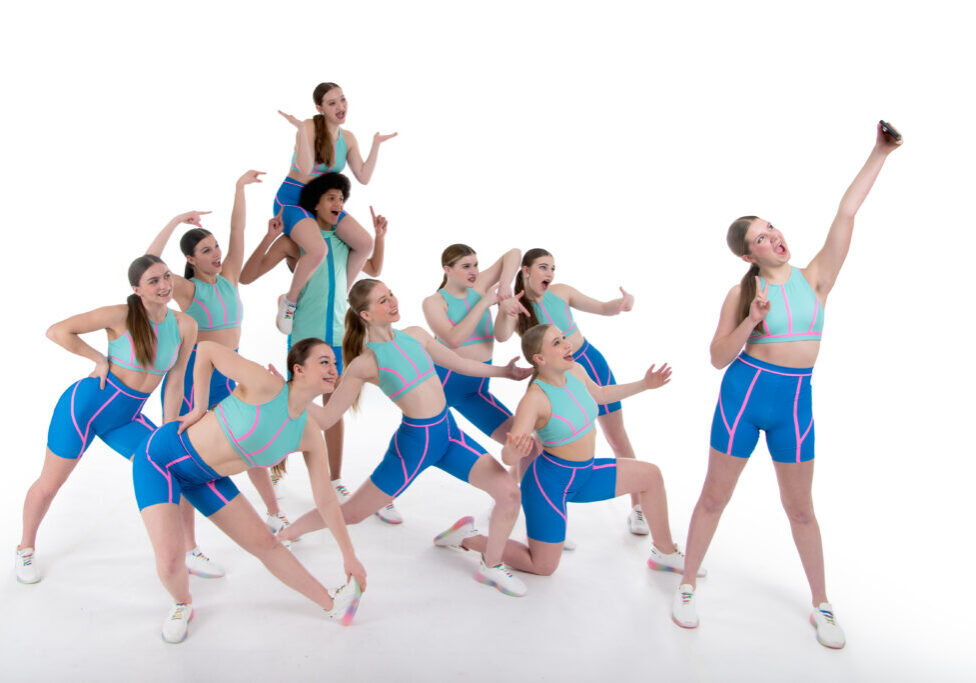 A posed photo of a group of dancers posing for a selfie